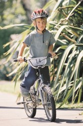 Child cycling in park
