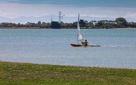 Yacht sailing on the estuary