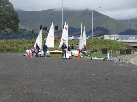Image of yacht club members getting set up on the shore at Scott Park