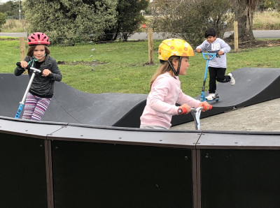 Kids playing at a Burwood temporary pump track