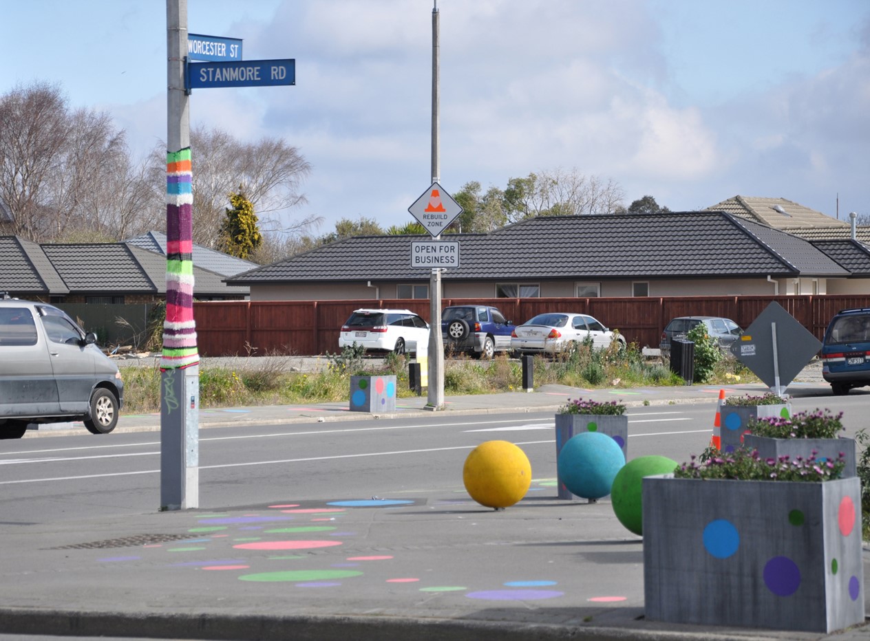 A street corner with painted footpaths and rubber ball seats