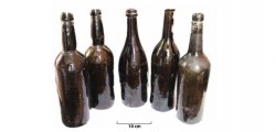 Alcohol bottles from pile hole cache