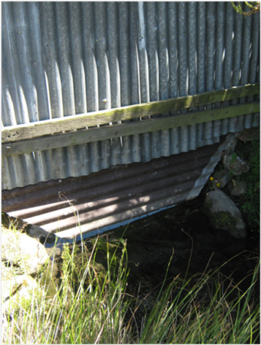 Example of a problematic fence built across a waterway