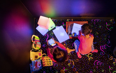 Kids playing with innovative lighting and sound technology.
