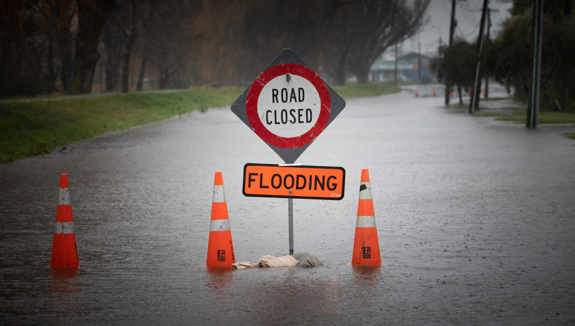 Road closed sign on a flooded road