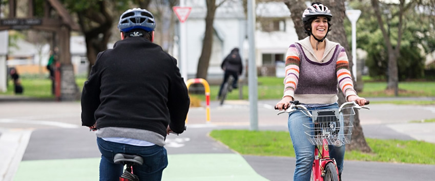 People cycling on Little River cycleway